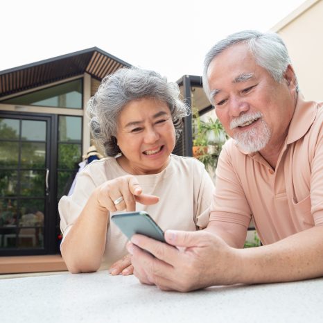 A senior couple comparing available Medicare plans.