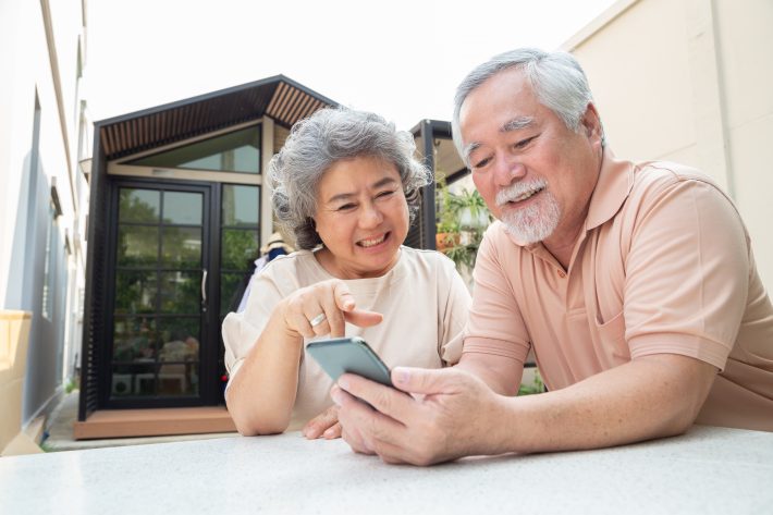 A senior couple comparing available Medicare plans.