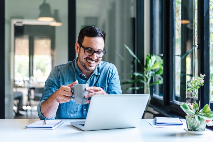 Happy Male Professional Having Coffee. Young Smiling Businessman