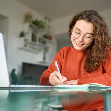Young Smiling Pretty Woman Student Using Laptop Elearning Or Rem